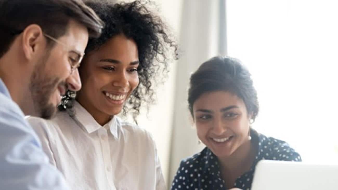 Happy people looking at a connected device screen