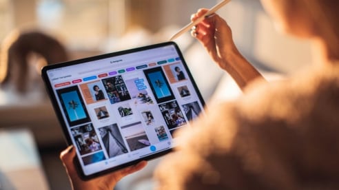 Person using a tablet with a stylus